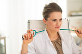 Portrait of relaxed doctor woman in office