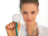Closeup on doctor woman using stethoscope