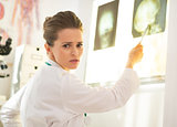 Doctor woman pointing on lightbox