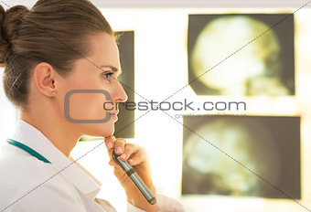 Portrait of doctor woman in front of lightbox