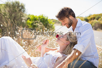 Attractive couple relaxing in the countryside