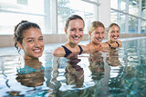 Female fitness class smiling at camera