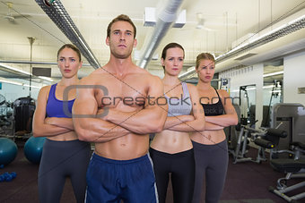 Serious fitness class posing together