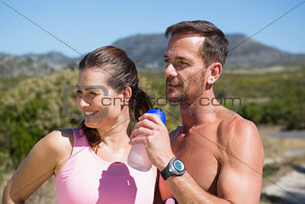Active couple jogging in the countryside