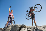 Fit cyclist couple at the summit
