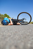 Cyclist lying on the road after an accident