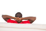 Man in red jersey sitting on couch