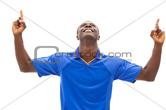 Excited football fan in blue cheering