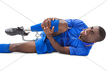Injured football player lying on the ground