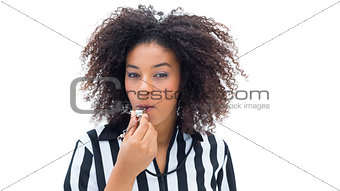 Pretty referee blowing her whistle