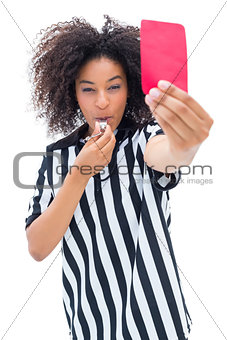 Pretty referee blowing her whistle and showing red card