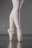 Ballerina standing en pointe in ballet slippers