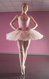 Graceful ballerina standing en pointe
