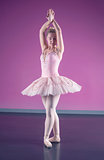 Graceful ballerina standing in fifth position