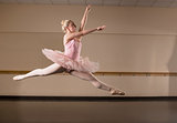 Beautiful ballerina dancing in pink tutu