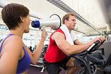 Personal trainer shouting at client through megaphone