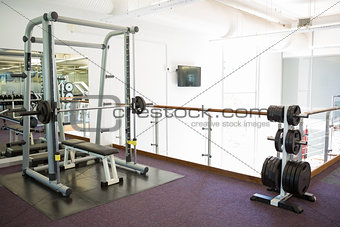 Empty weights room with bench press