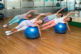 Fitness class on exercise balls in studio