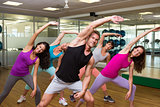 Fitness class led by handsome instructor