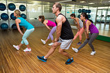 Fitness class led by handsome instructor
