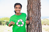 Pretty environmental activist showing her t-shirt