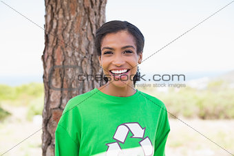 Pretty environmental activist smiling at camera