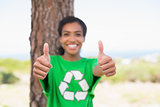 Pretty environmental activist smiling at camera showing thumbs up