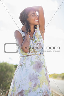 Beautiful woman in floral dress smiling