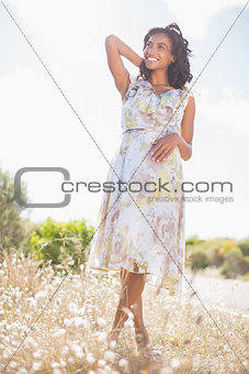 Beautiful woman in floral dress smiling