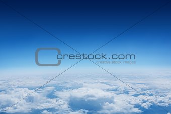 Blue sky over clouds at high altitude