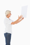 Angry woman shouting at piece of paper