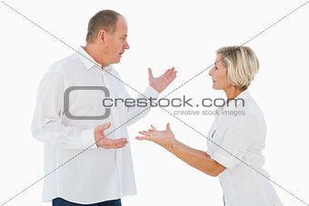 Angry older couple arguing with each other