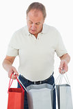 Mature man looking at his purchases