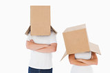 Mature couple wearing boxes over their heads