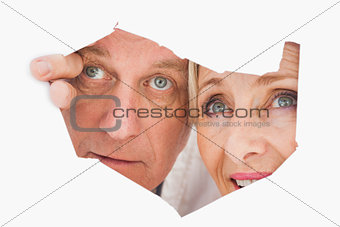 Older couple looking through rip