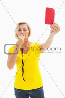 Mature blonde showing red card to camera