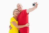 Happy mature couple taking a selfie together