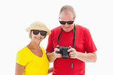 Happy mature couple wearing sunglasses