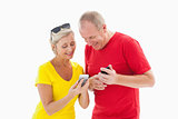 Happy mature couple looking at smartphone together