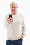Happy mature man sending a text