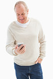 Happy mature man sending a text