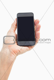 Woman showing black smartphone screen