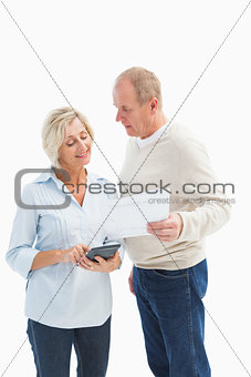 Mature couple working out their bills