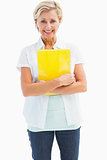 Happy mature student holding notebook