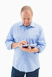 Mature man using his tablet pc