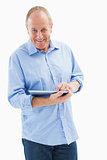 Happy mature man using his tablet pc