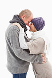 Happy mature couple in winter clothes embracing