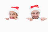 Festive young couple smiling at camera