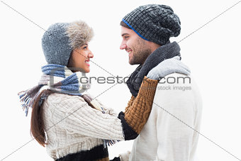 Attractive young couple in warm clothes hugging