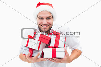 Handsome festive man holding gifts